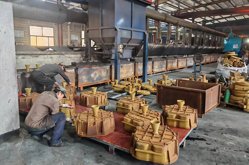 Workers preparing sand casting molds at Kurt Foundry
