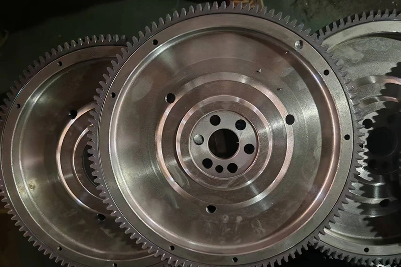 Ductile iron custom flywheel showing precision-machined hub bore and keyway.