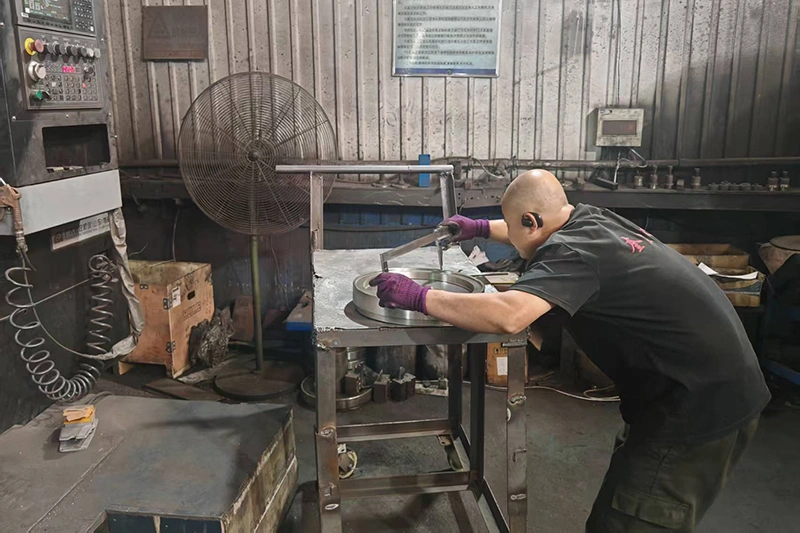 Quality control inspection of custom cast iron flywheels at Kurt Foundry — CMM dimensional verification and NDE testing.