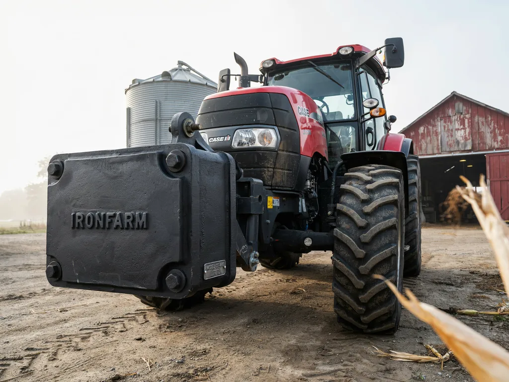 Custom cast iron tractor counterweight block mounted on the front of an agricultural tractor