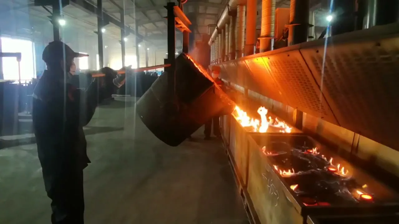 Pouring grey iron into sand molds on the pouring line at Kurt Foundry